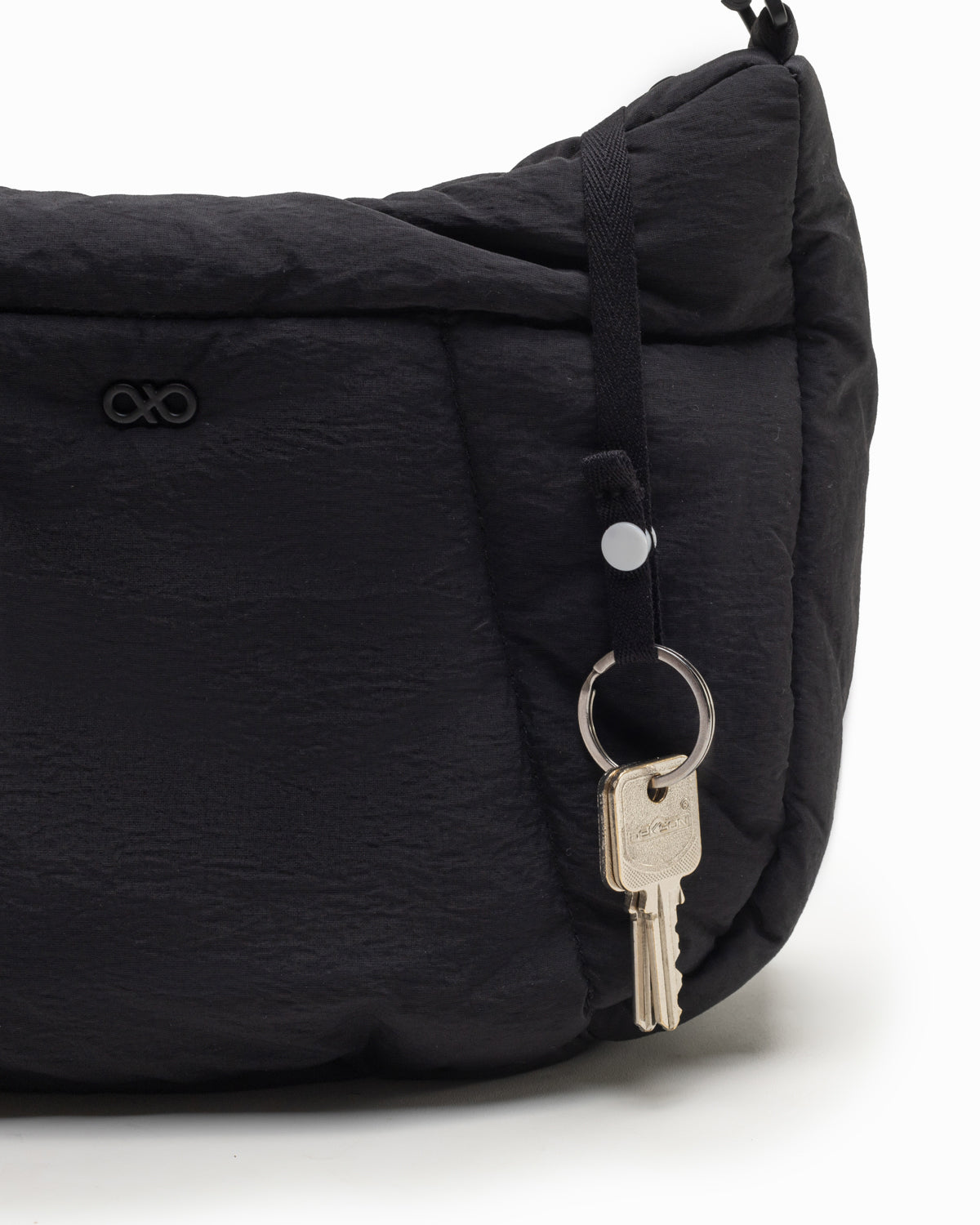 COSY PUFFY CROSSBODY BAG IN JET BLACK