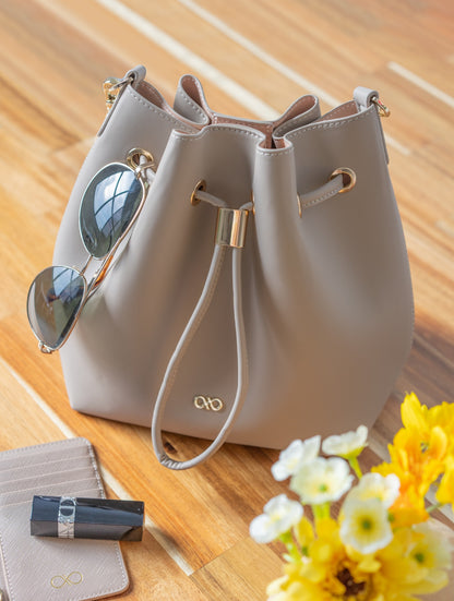 MINI REINA MAGIC BUCKET BAG IN TAUPE