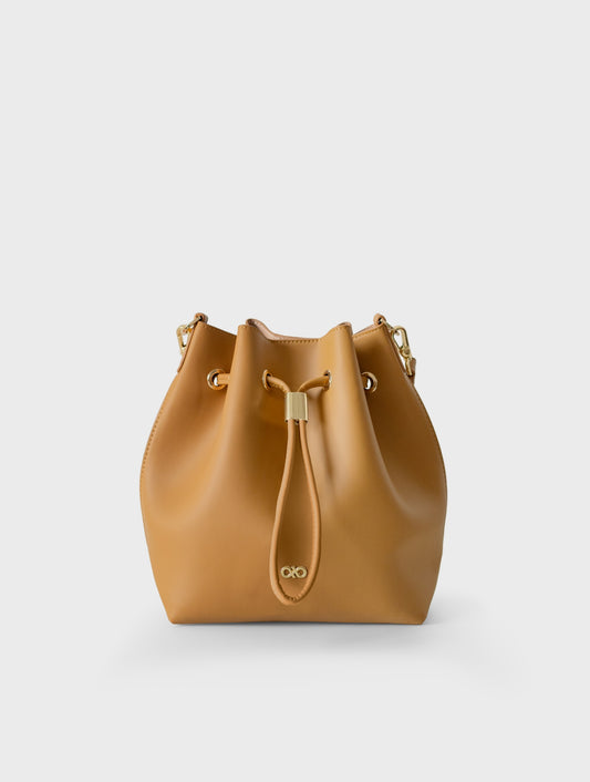 MINI REINA MAGIC BUCKET BAG IN CAMEL